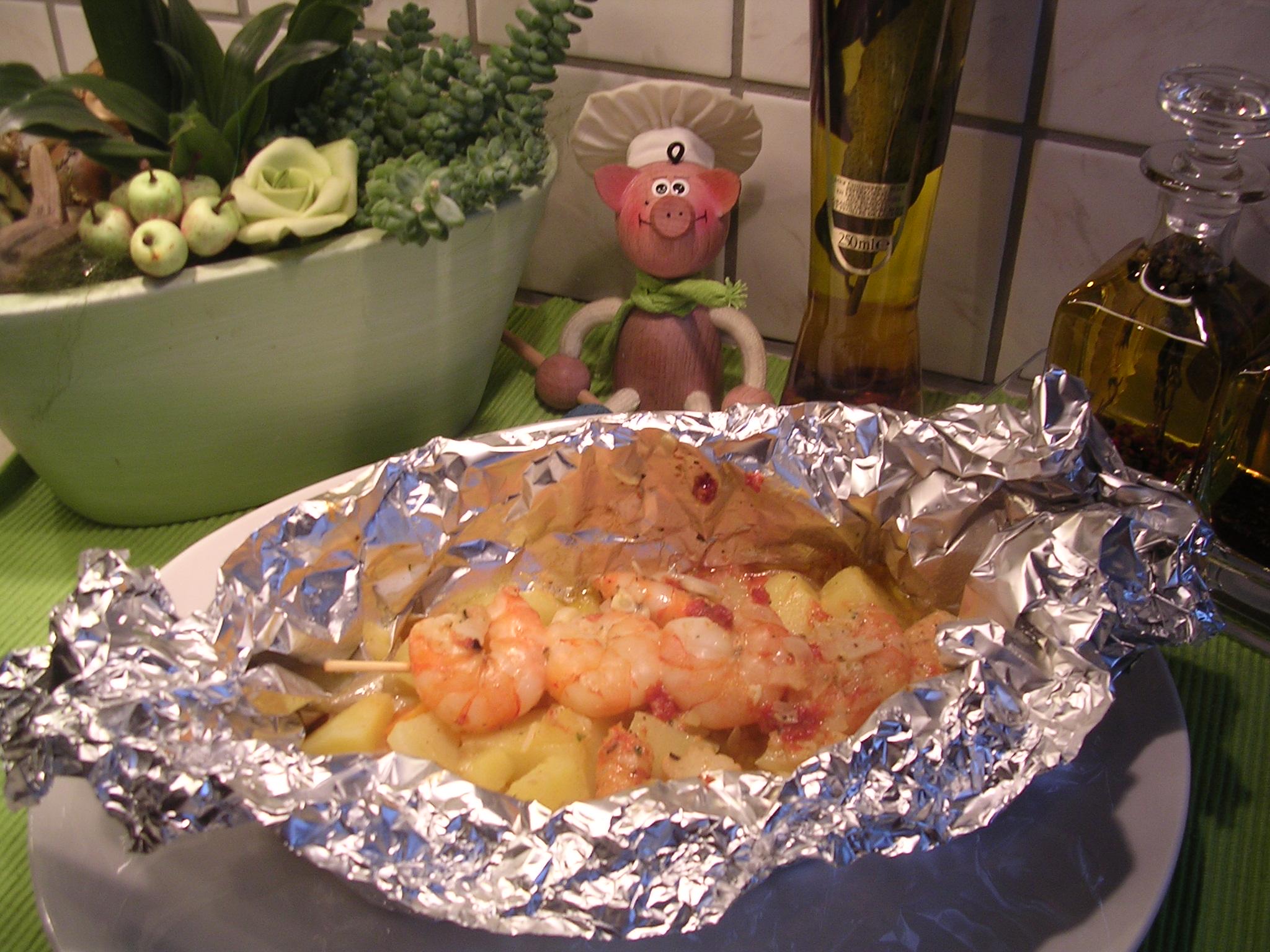 Papillote van scampi's op een spiesje