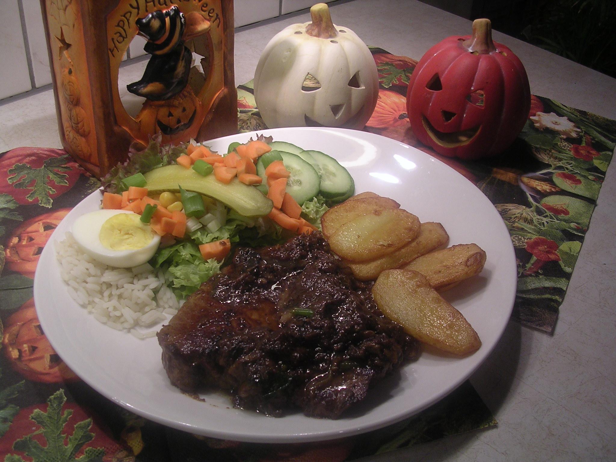 Rumsteak met rode ui en champignons